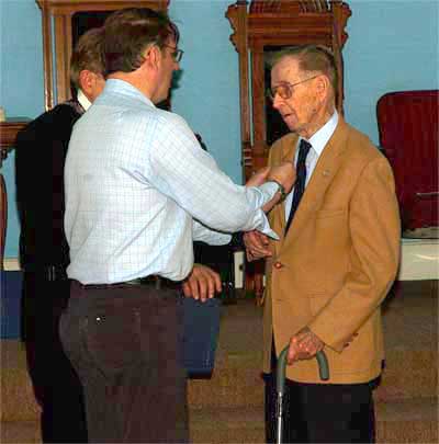 Brother Flasker receives his 50 year pin